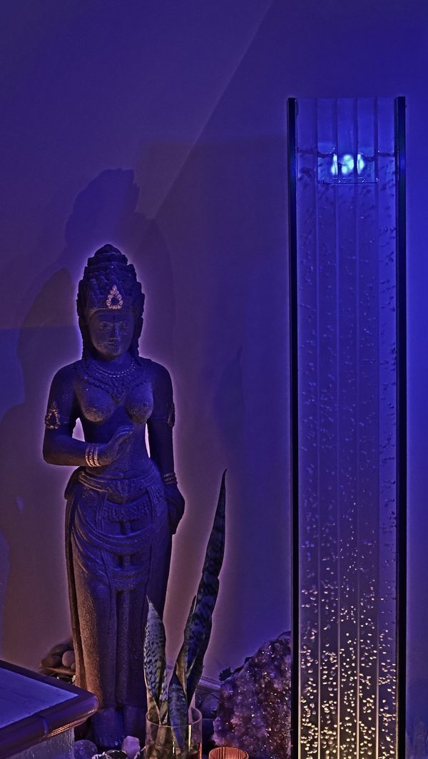 Corner with statue of goddess and bubbles tower